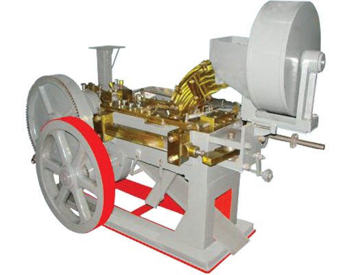 AUTOMATIC BOLT HEAD TRIMMING AND SHANK REDUCING MACHINE